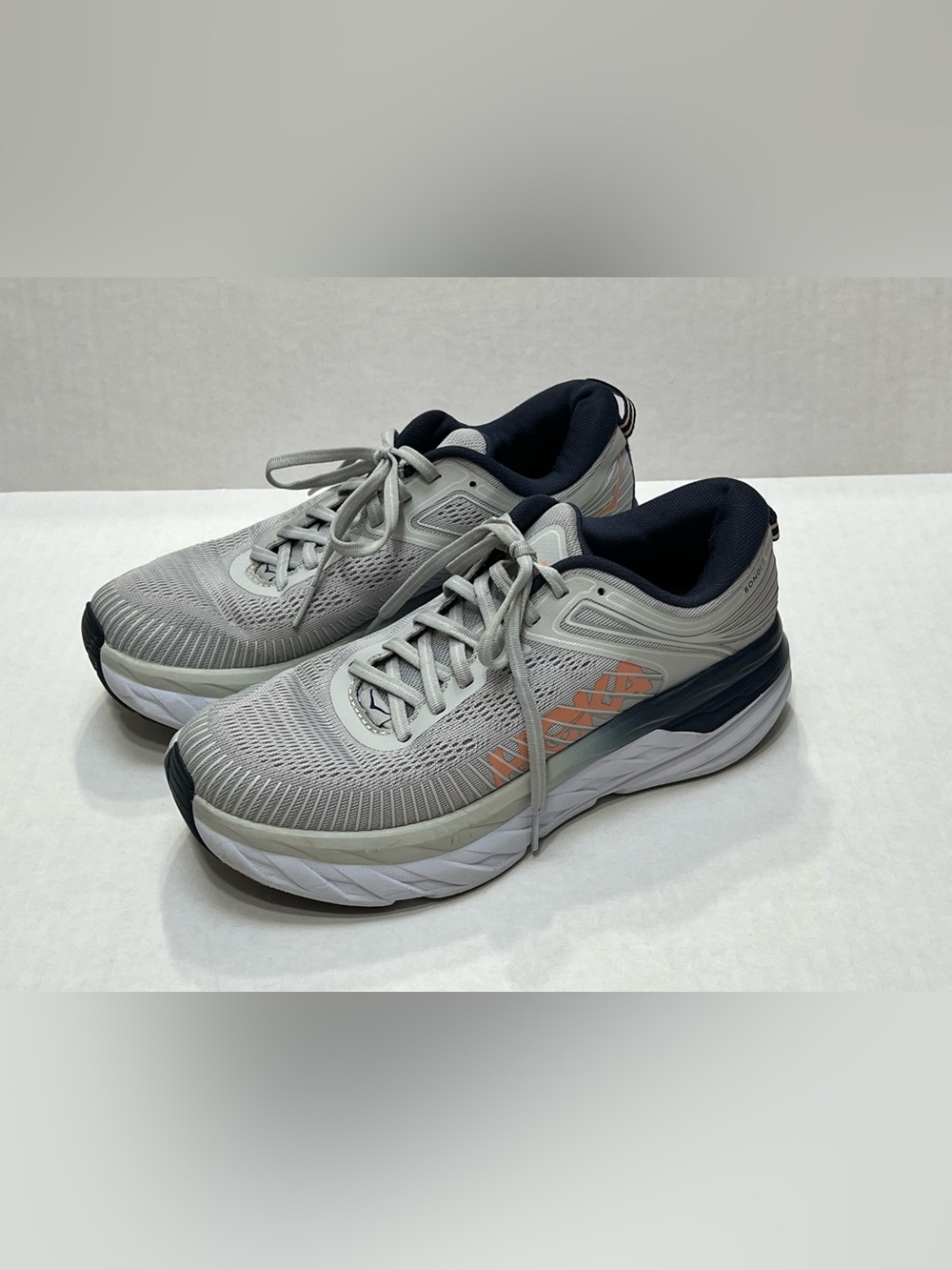 Hoka One One Women’s Light Gray Running Shoes with Navy and Peach Accents